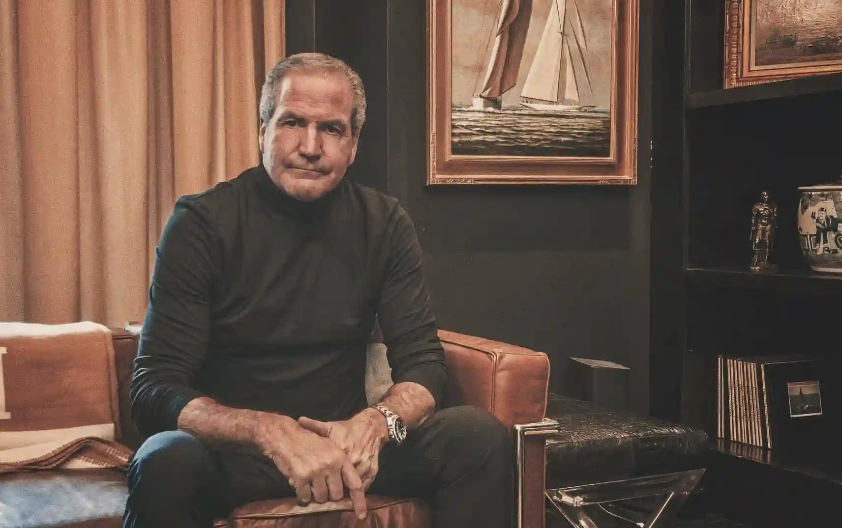 Dr. Anthony Berlet, board-certified plastic surgeon and founder of Berlet Plastic Surgery, seated in his office